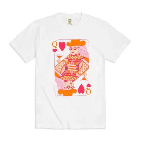 White t-shirt features a Queen of Hearts playing card design in shades of pink and orange.  The queen is wearing star shaped sunglasses, holding a martini glass, and features a pattern of design elements like miniature airplanes, stars, and a checkerboard.  Design is a full chest design.  